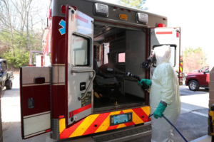 employee cleaning out an emergency vehicle